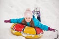 Girl having fun on snow tube.Girl is riding a tubing