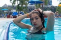 Girl having a good time in the hotel pool Royalty Free Stock Photo