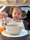 Girl having a healthy breakfast outdoors Royalty Free Stock Photo