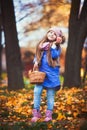 Girl having a picnic in the autumn park