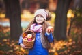 Girl having a picnic in the autumn park