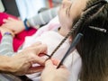 Girl having plaits done at hairdresser Royalty Free Stock Photo