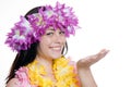 Girl in a hawaiian wreath pointing with hand Royalty Free Stock Photo