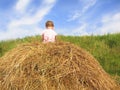 Girl on hayrack Royalty Free Stock Photo