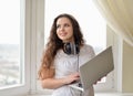 Girl with the head-phones working in a laptop Royalty Free Stock Photo