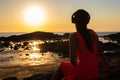 Girl in headphones listening to music in the city at sunset. Royalty Free Stock Photo