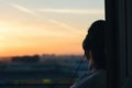 Girl in headphones listening to music in the city at sunset Royalty Free Stock Photo