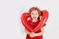 Girl with heart, beautiful little girl holding big balloon heart