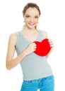 Girl with a heart-shaped pillow Royalty Free Stock Photo