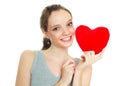 Girl with a heart-shaped pillow Royalty Free Stock Photo