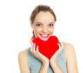 Girl with a heart-shaped pillow Royalty Free Stock Photo