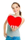 Girl with a heart-shaped pillow Royalty Free Stock Photo