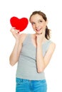 Girl with a heart-shaped pillow Royalty Free Stock Photo