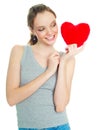 Girl with a heart-shaped pillow Royalty Free Stock Photo