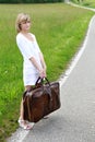 Girl with heavy suitcase