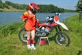 Girl in a helmet costs about motorbike motocross