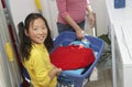 Girl Helping Mother Washing Clothes