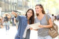 Girl helping to a tourist who asks direction