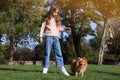 Little girl with her cute dog walking in park Royalty Free Stock Photo