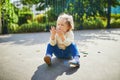 Girl at her dirty hands after drawing with colorful chalks Royalty Free Stock Photo