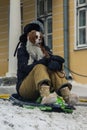 The girl with her dog rides on a sled in a hill in Tallinn. Estonia Royalty Free Stock Photo