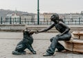 Girl With Her Dog Statue with the beautiful cityscape of Budapest in the background Royalty Free Stock Photo