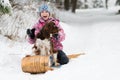 Girl and her dog on a toboggan