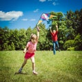 The girl and her father play with a kite. Royalty Free Stock Photo