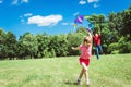 The girl and her father play with a kite. Royalty Free Stock Photo