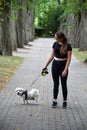 Teenage girl makes a walk with her havanese dog Royalty Free Stock Photo