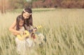 Girl is with her mother to meadow outdoor in nature on sunny day Royalty Free Stock Photo