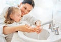 Girl and her mother are washing hands Royalty Free Stock Photo