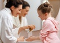 girl and her mother are washing hands Royalty Free Stock Photo