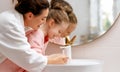 girl and her mother are washing hands Royalty Free Stock Photo