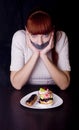 Girl with her mouth sealed with adhesive tape and cakes Royalty Free Stock Photo