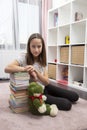 Girl in her room, with a lot of book Royalty Free Stock Photo