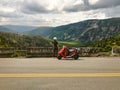 Girl with her scooter enjoying beautiful view of mountains scene Royalty Free Stock Photo