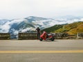 Girl with her scooter enjoying beautiful view of mountains scene Royalty Free Stock Photo