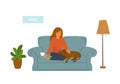 Girl with her sleeping dog on sofa at home scene Royalty Free Stock Photo