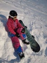 A girl with her snowboard and her first practice for snowboarding at Niseko illage, Sapporo , Japan Royalty Free Stock Photo