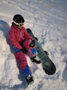 A girl with her snowboard and her first practice for snowboarding at Niseko illage, Sapporo , Japan