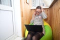 Girl hid, closed in self-isolation. Remote working at home on the phone