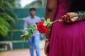 A girl hide redrose Royalty Free Stock Photo