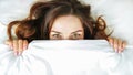 Girl hides her face under the covers.Concept of healthy sleep, insomnia, comfort zone Royalty Free Stock Photo