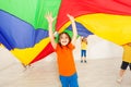 Girl hiding under parachute during sports festival Royalty Free Stock Photo