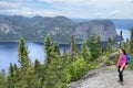 Girl hiker admiring Saguenay Fjord from Saguenay Fjord from an aerial viewpoint in Quebec Royalty Free Stock Photo