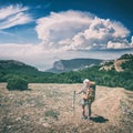 Girl hiker with backpack enjoy the valley Royalty Free Stock Photo