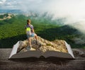 Girl hiker on a book