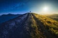 Girl hiker between day and night