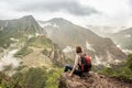 Girl-hiker looking on top of Huayna Picchu, looking on Machu Picchu